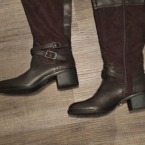 Below the knee dark brown boots.